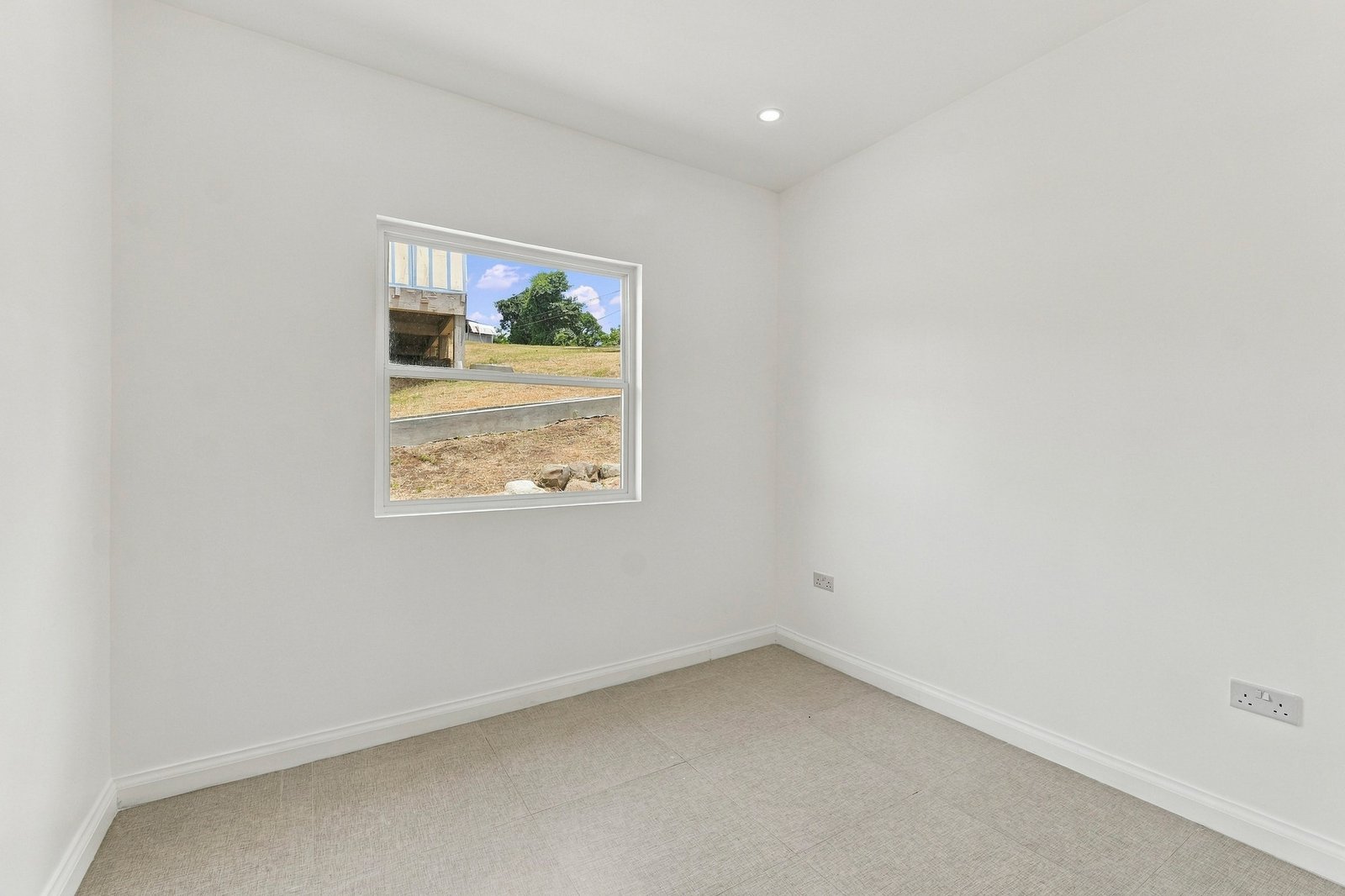 Allspice design, Lot 128: unfurnished room with a single window and tiled floor.