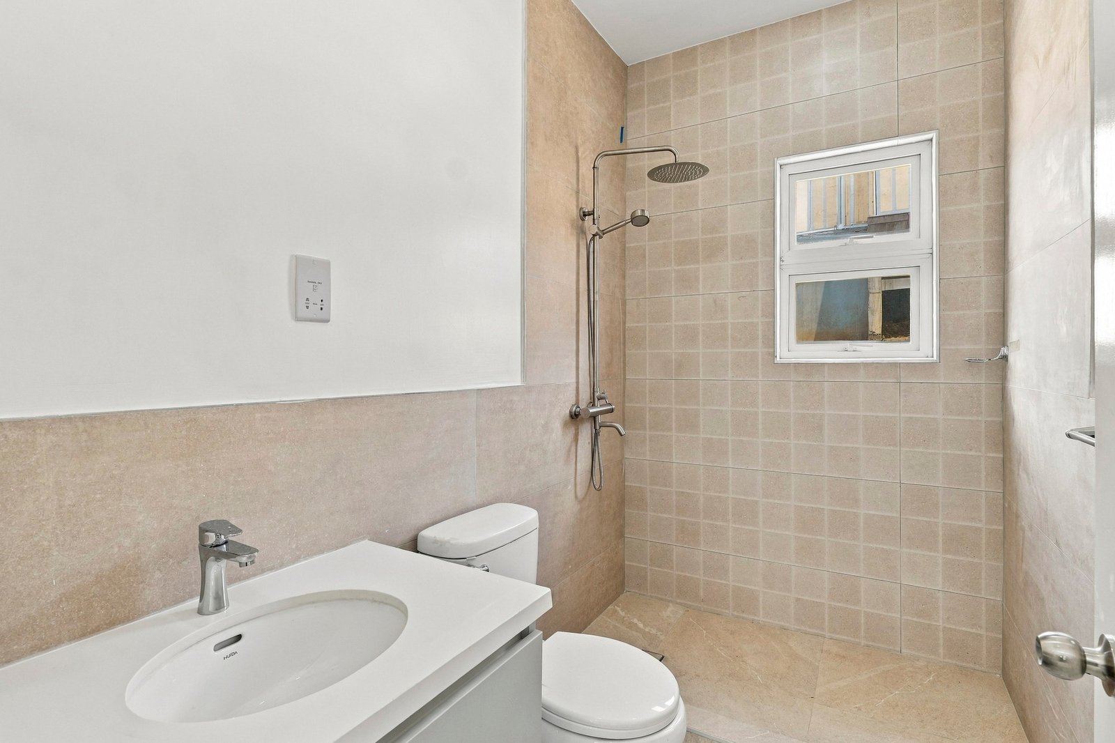 Allspice design, Lot 128: bathroom with a vanity, toilet and tiled shower on the right.