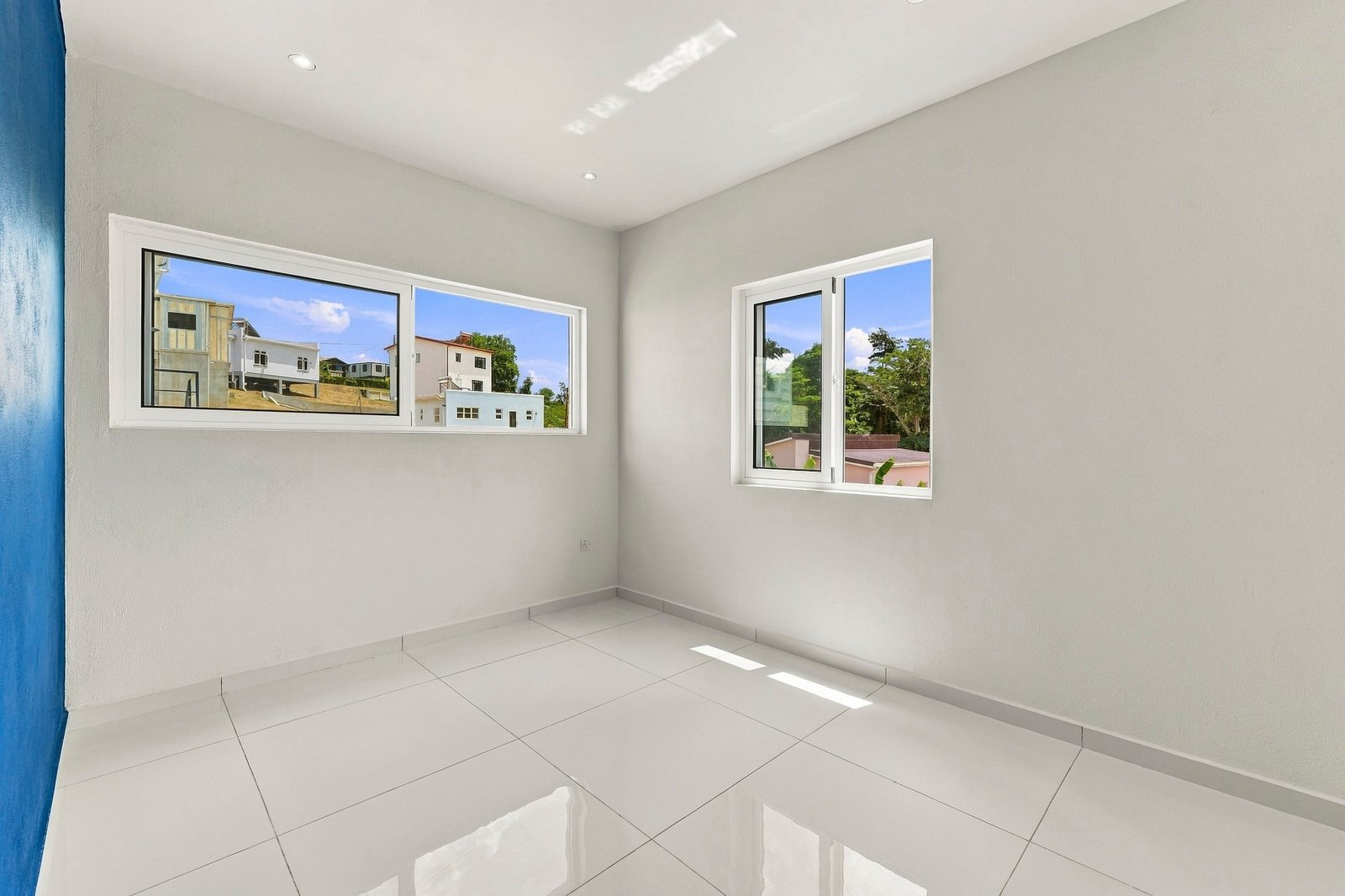 Bayleaf design, Lot 123: unfurnished room with a wide horizontal window and smaller side window.