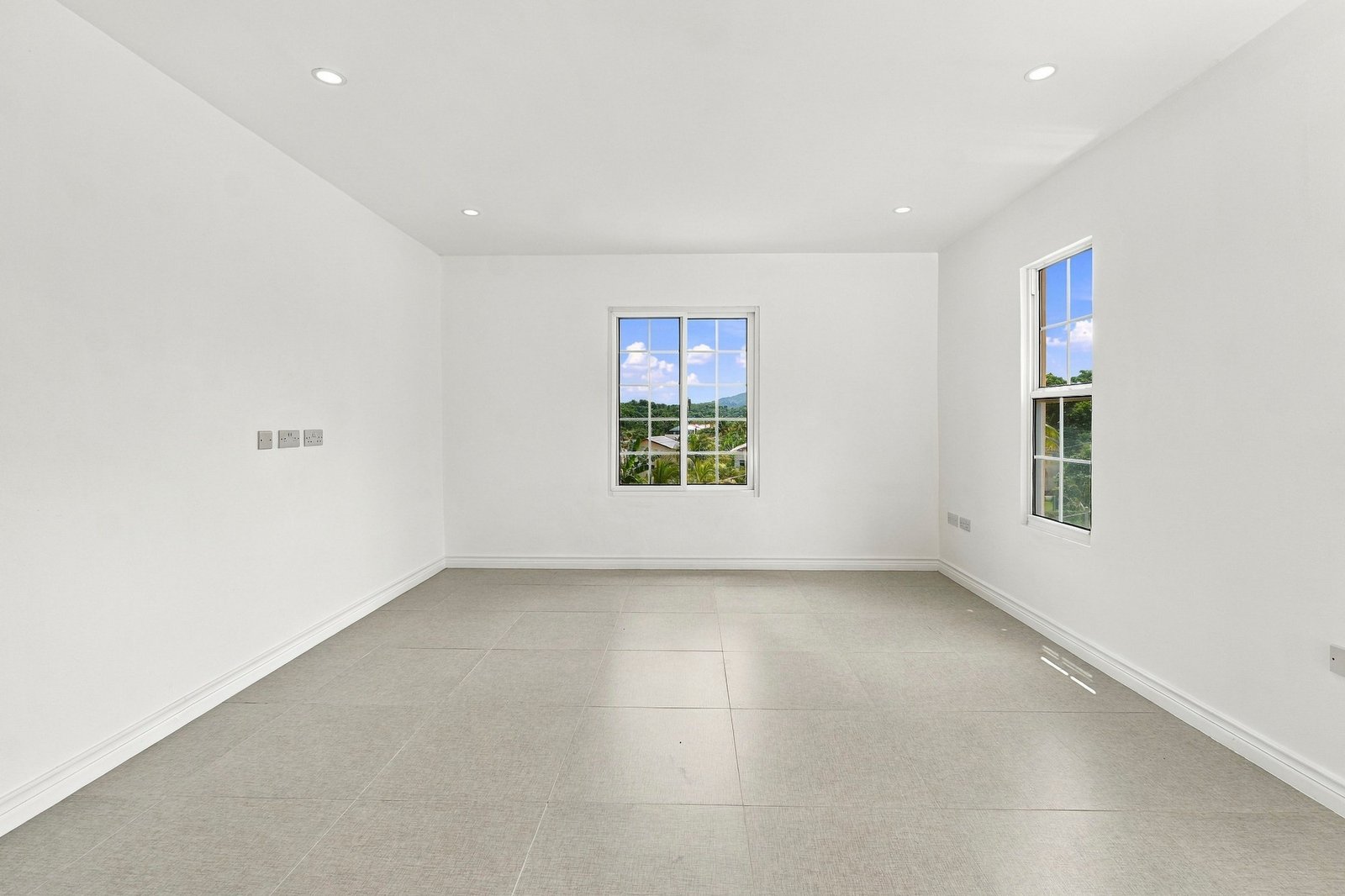 Coconut design, Lot 113: unfurnished living area with white walls and tiled floor.