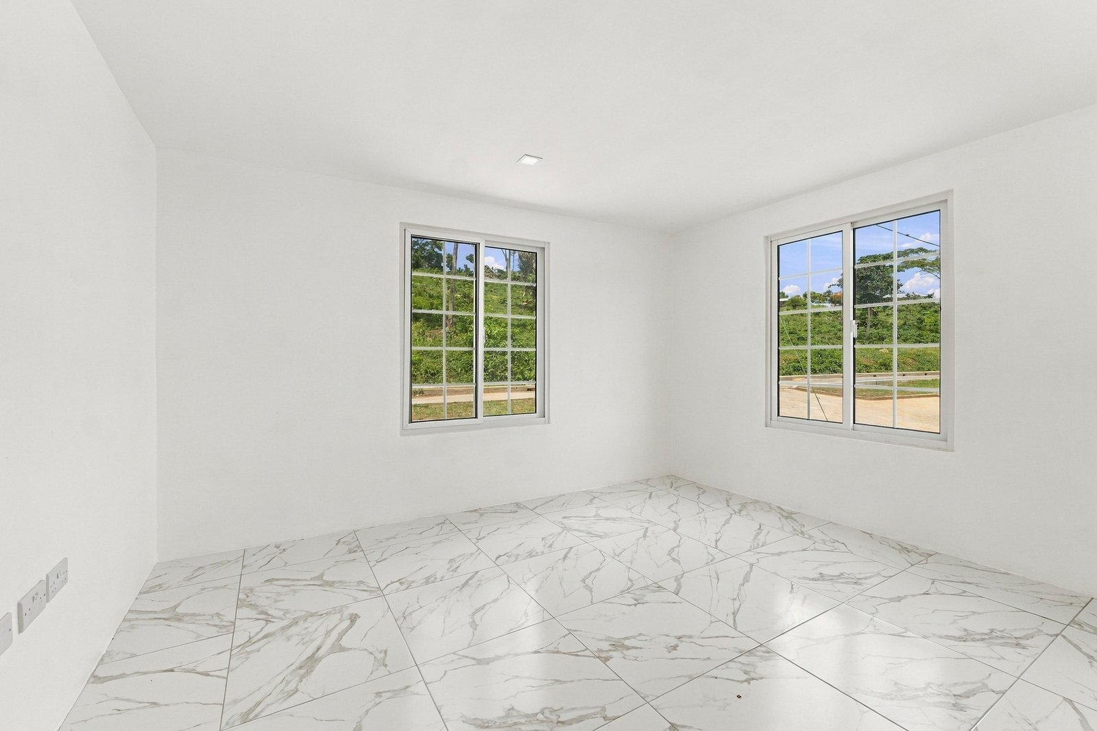 Coconut design, Lot 113: unfurnished room with two windows and marble-pattern floor tiles.