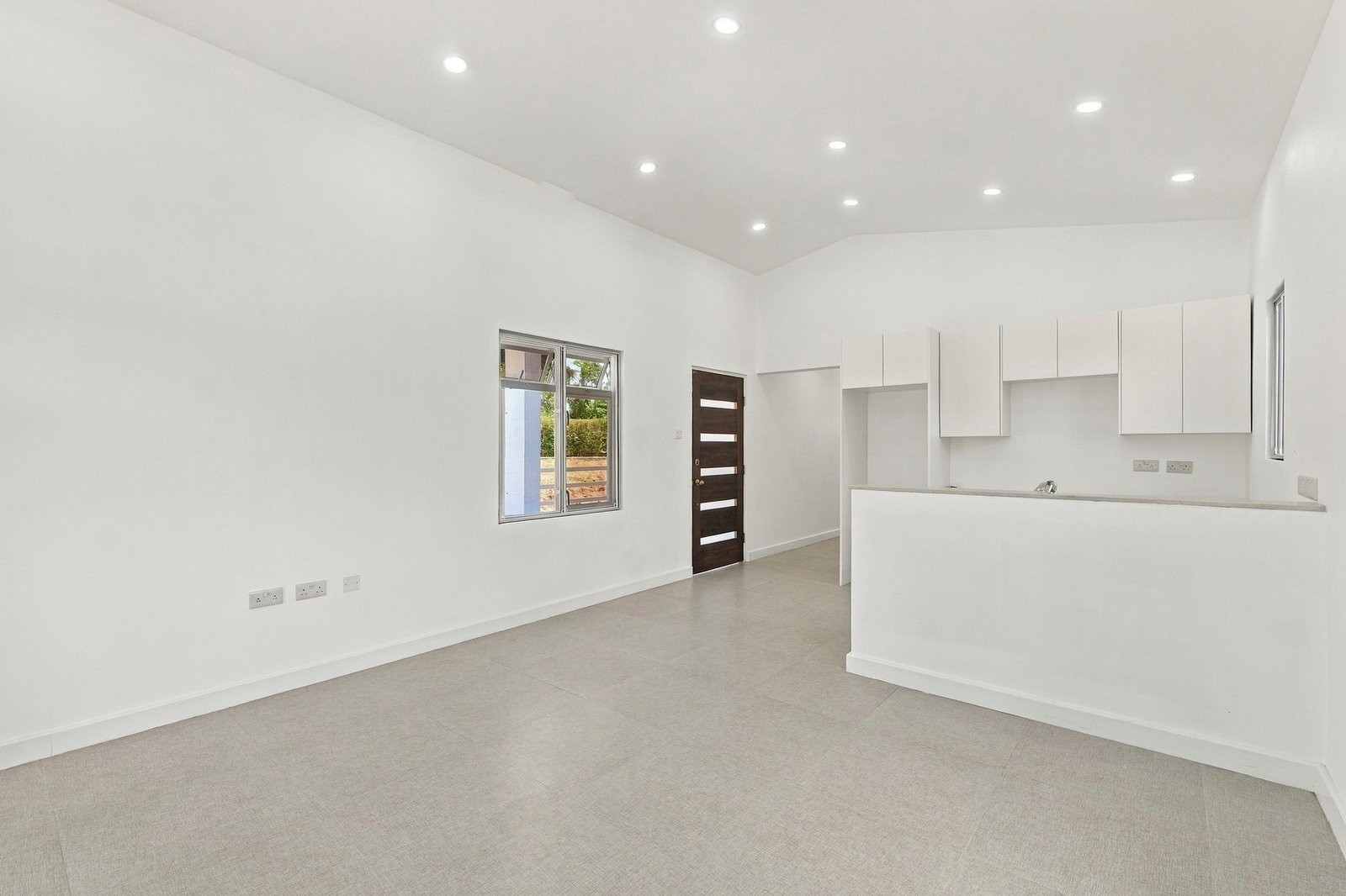 Hibiscus design, Lot 131: living area looking toward the white kitchen and front door.