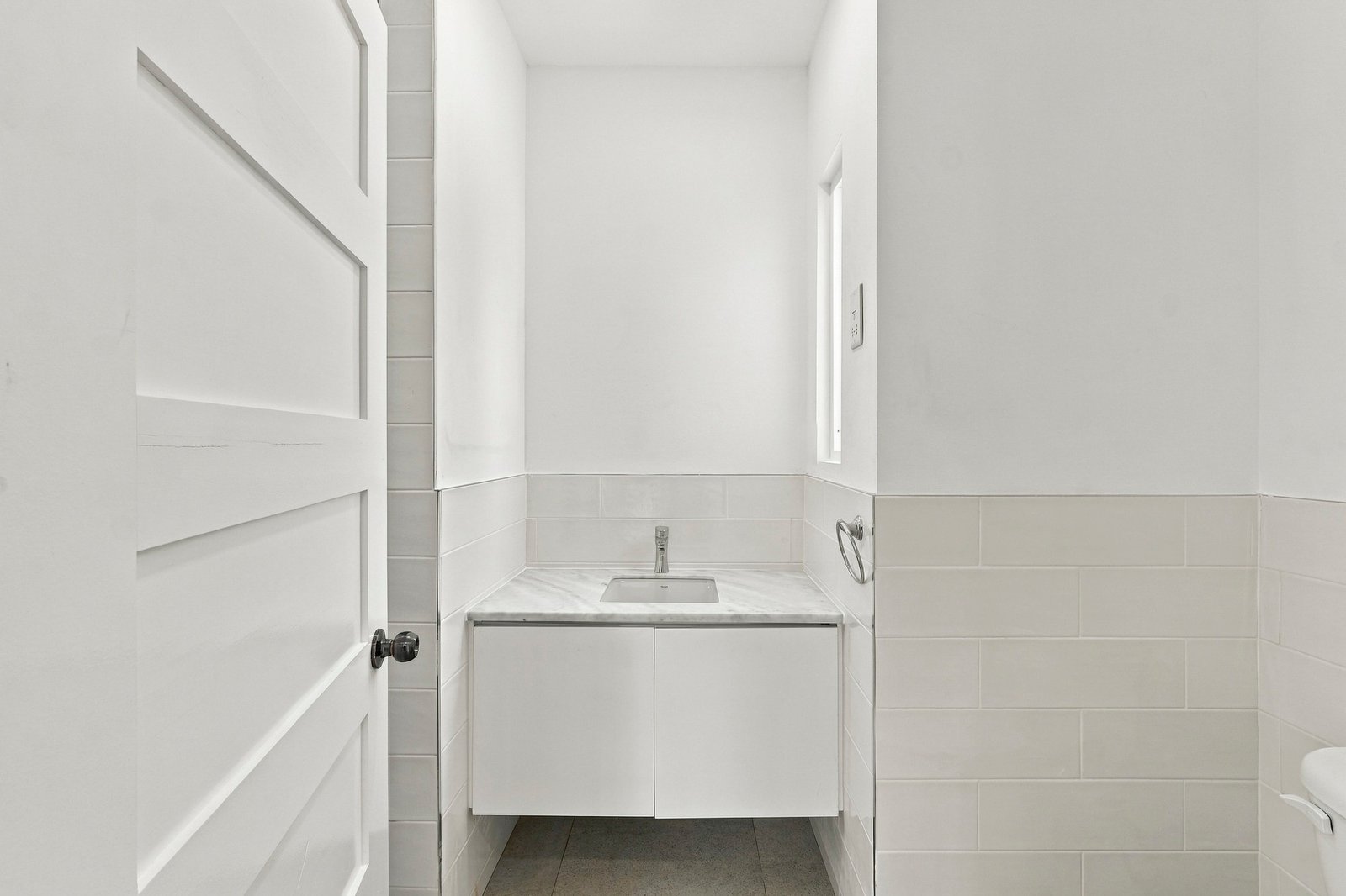 Hibiscus design, Lot 131: bathroom vanity beneath a narrow window.