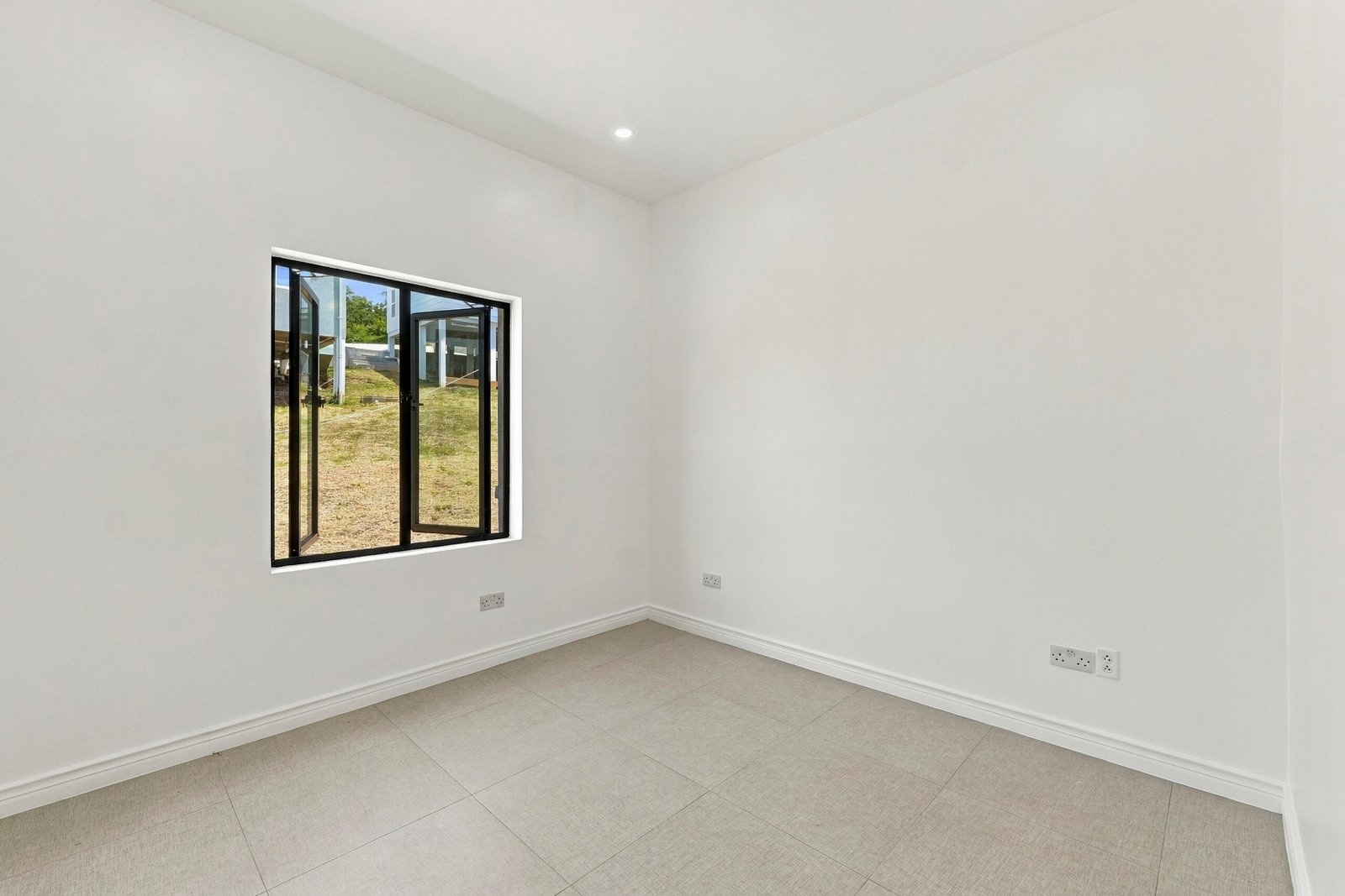 Sapodilla design, Lot 122: unfurnished room with a wide black-framed window.