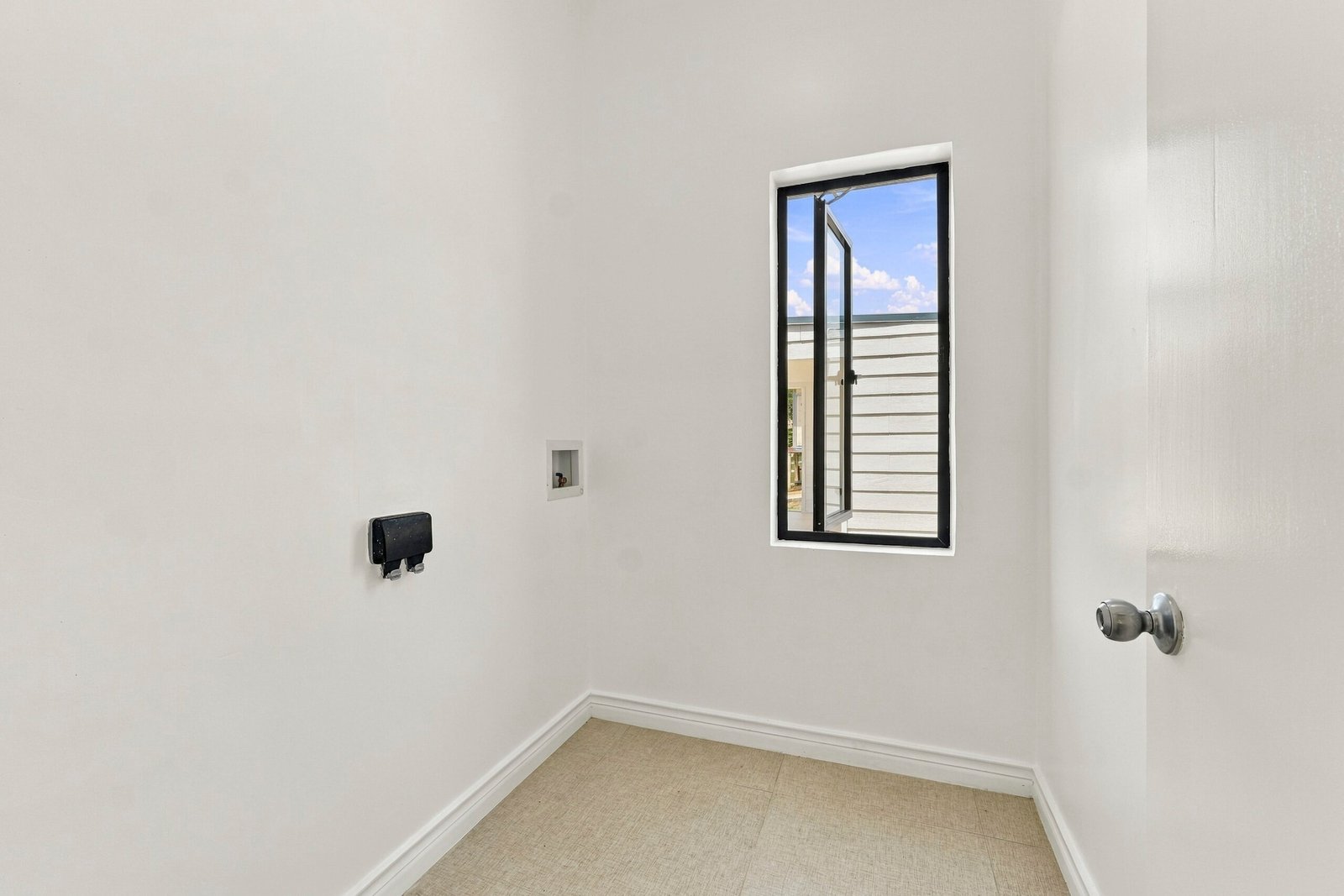 Sapodilla design, Lot 122: small utility space with wall connections and a window.